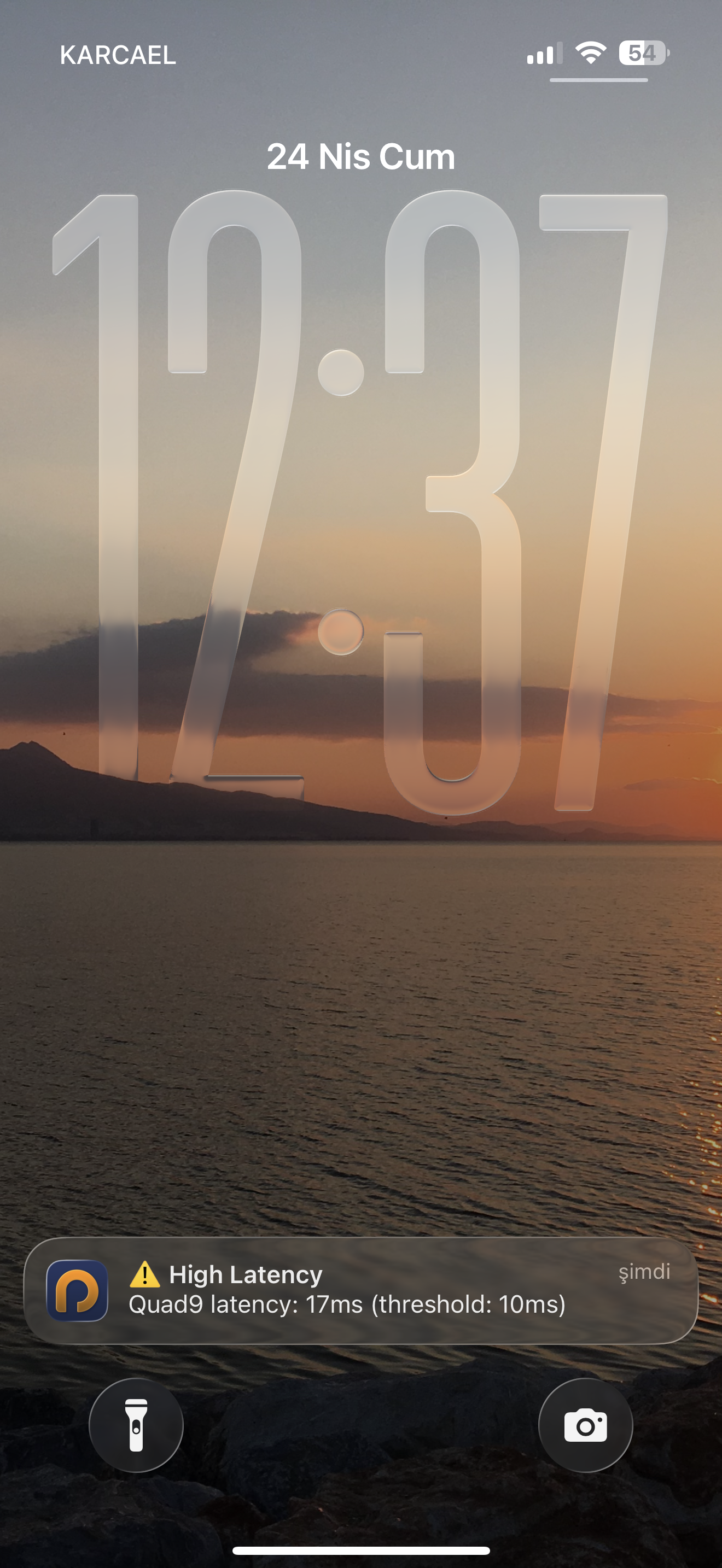 iOS lock screen showing a Pingstat push notification about an offline server